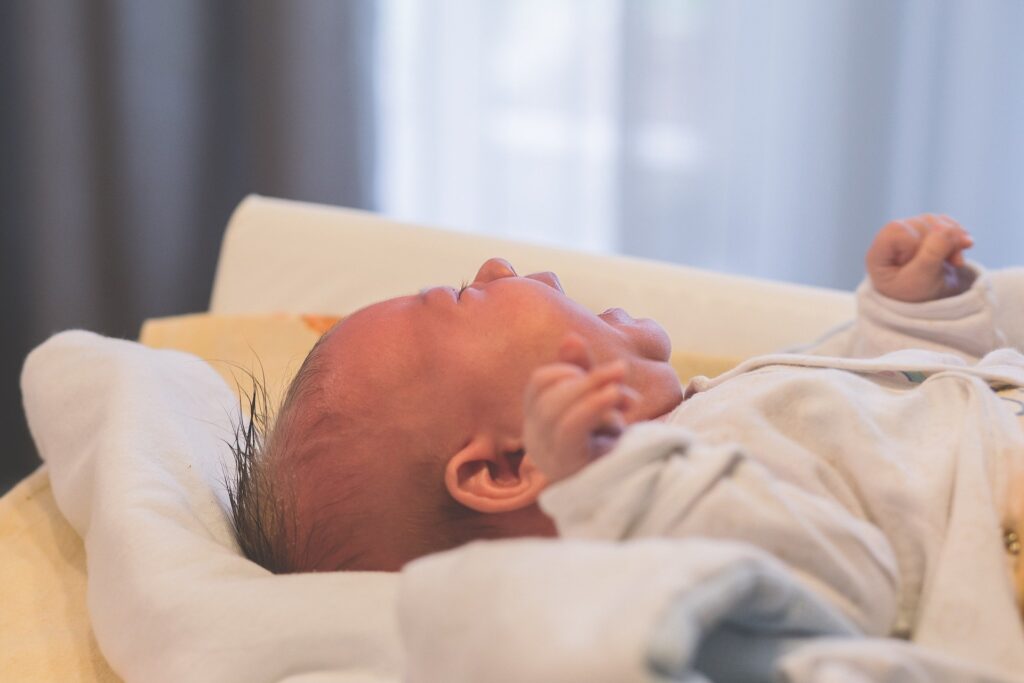 baby crying on changing table