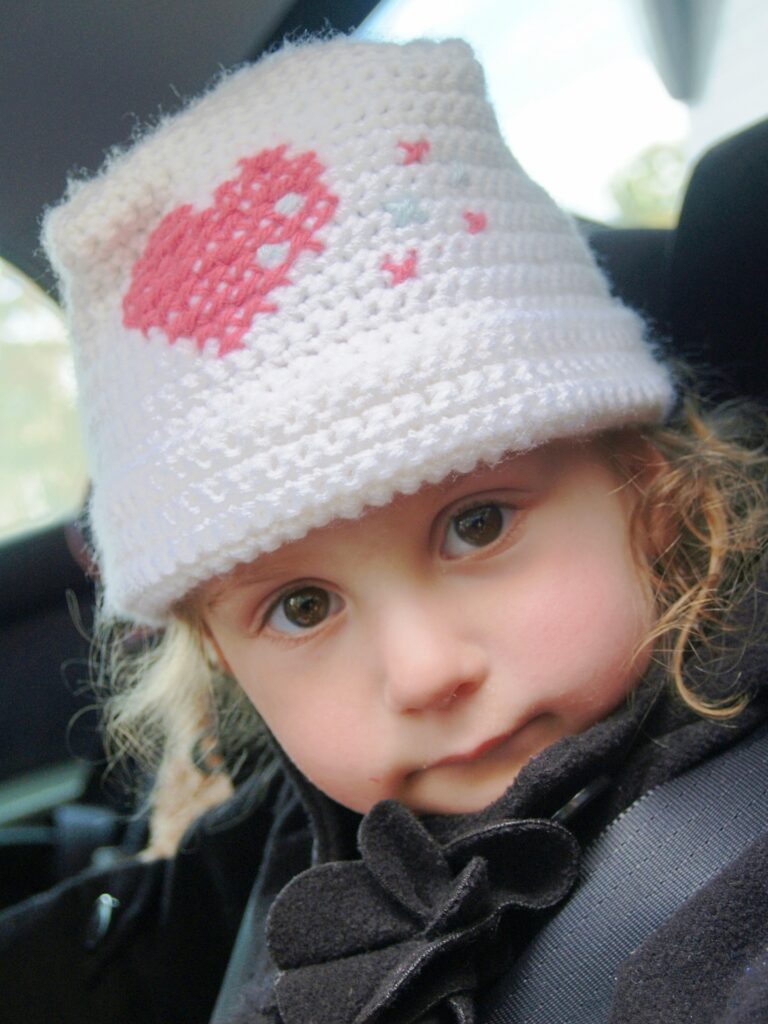 Little girl in her car seat