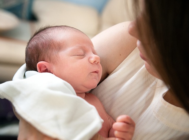 mother holding infant