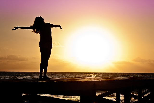 silouette of woman in sunset