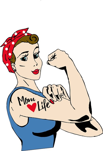 woman showing off strong arm with tattoo mom life