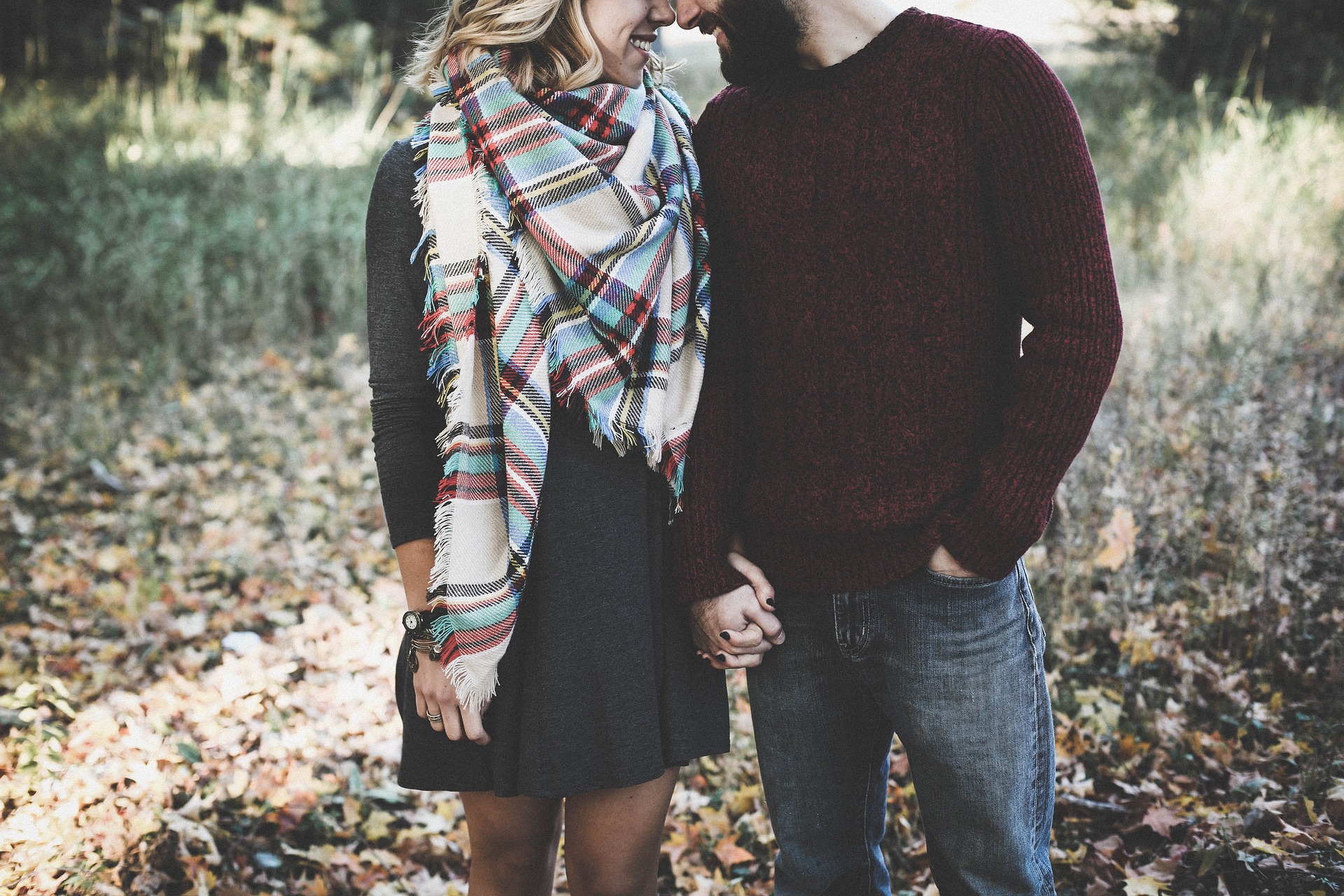 a couple holding hands and smiling