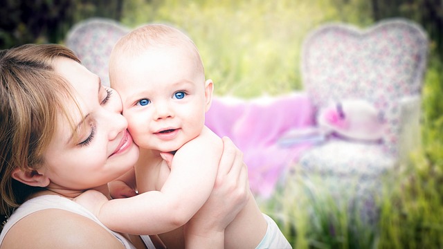 mother holding baby