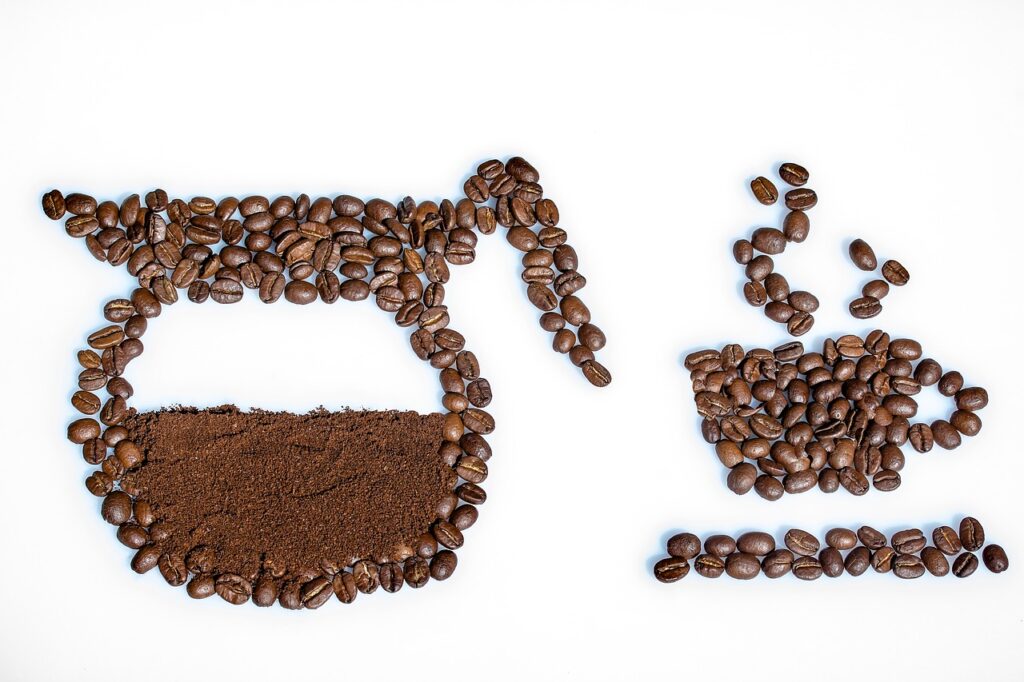 coffee beans outlined to make an image of a coffee pot and mug