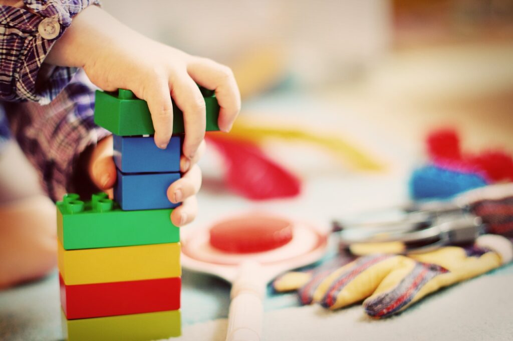 kid playing with toys