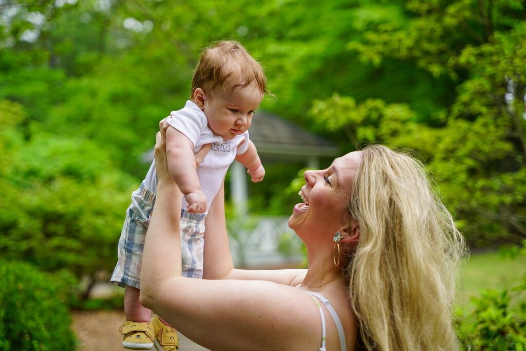 mom smiling at baby