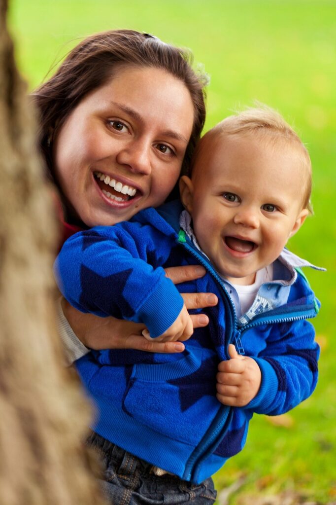 mother and baby smiling